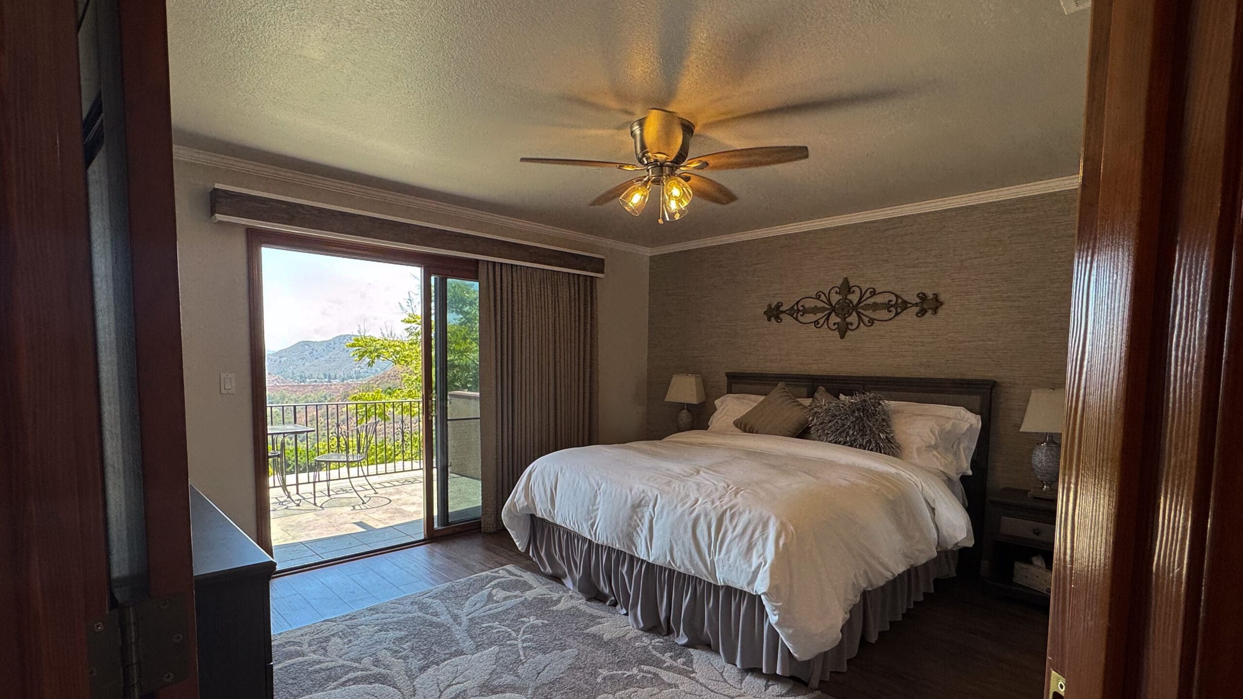 Inviting bedroom inside the Airbnb at Los Willows wedding venue in Fallbrook, CA, styled with neutral tones, plush bedding, and warm natural light — perfect for overnight stays or getting-ready moments