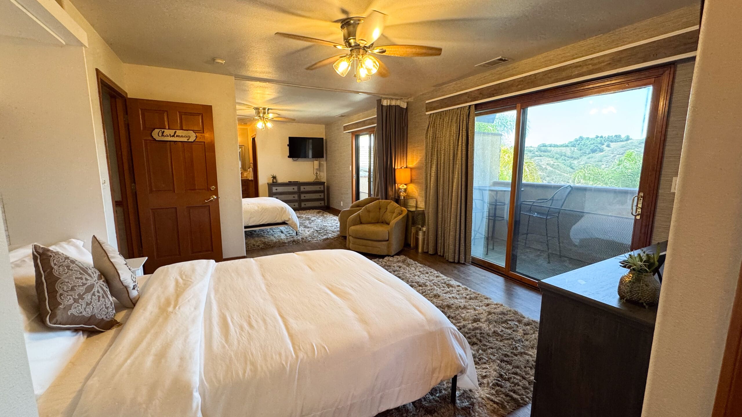 Inviting bedroom inside the Airbnb at Los Willows wedding venue in Fallbrook, CA, styled with neutral tones, plush bedding, and warm natural light — perfect for overnight stays or getting-ready moments